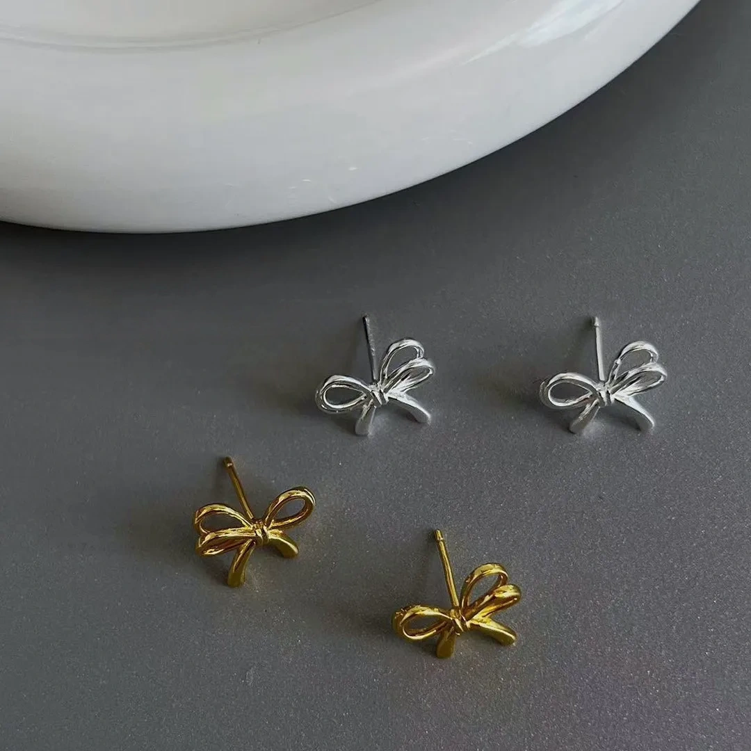 925 silver bow cut-out earrings