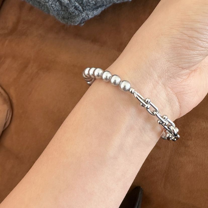 Grey faux pearl panelled horseshoe clasp bracelet