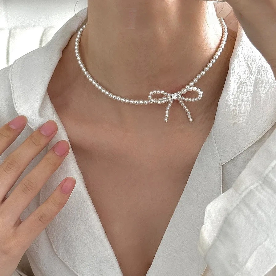 Sterling silver bow faux pearl gentle necklace