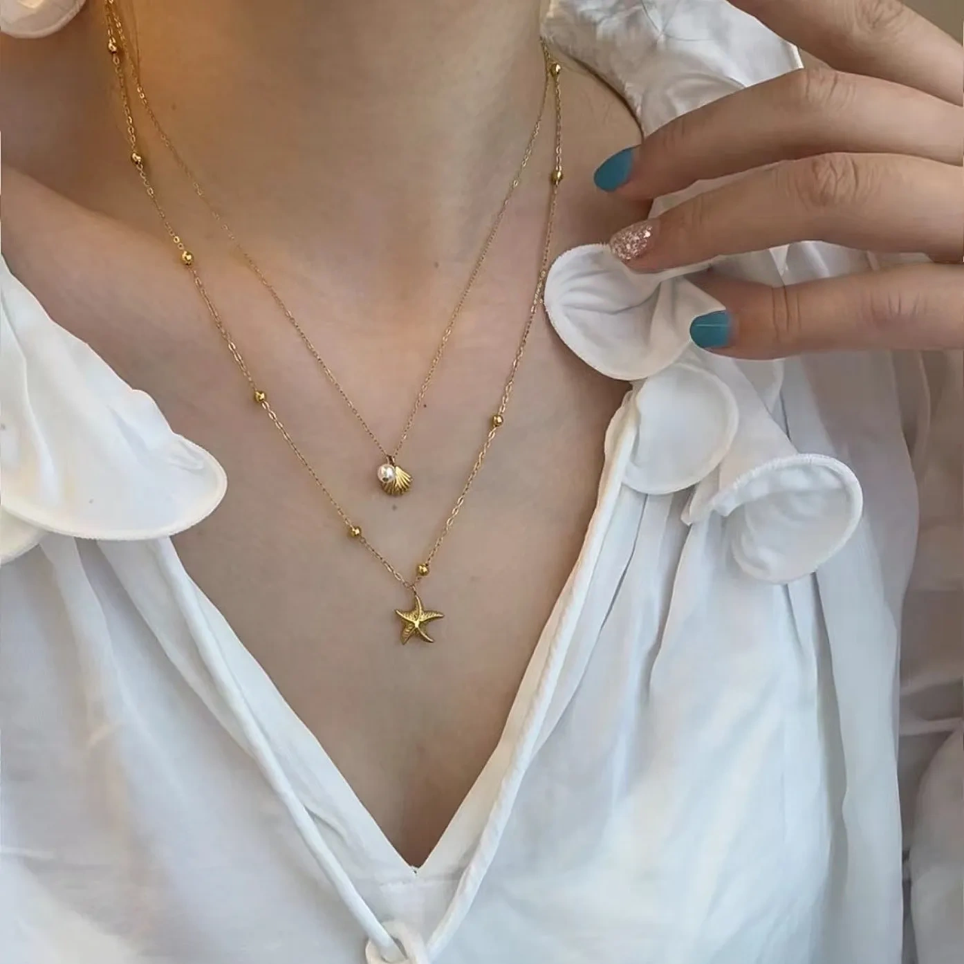 Double-layered starfish shell gold stacking necklace