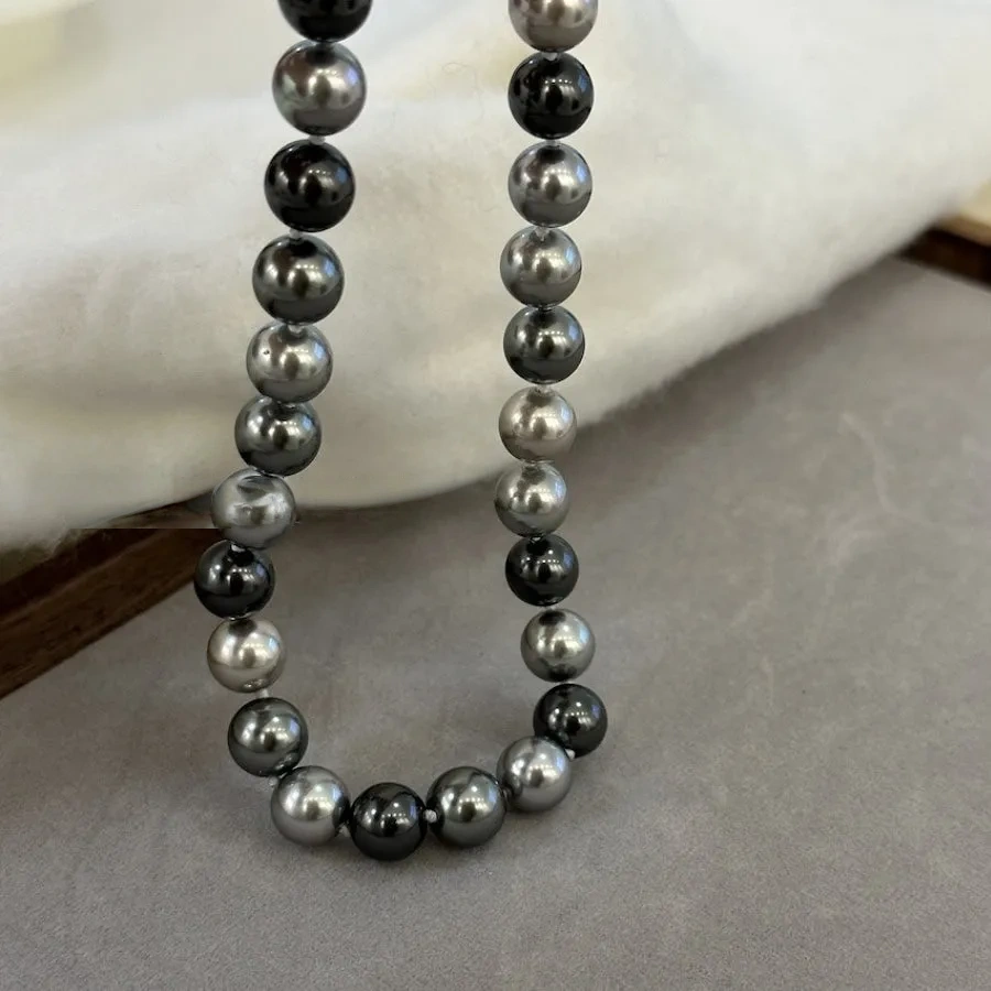 Necklace of faux melange gray-green pearls