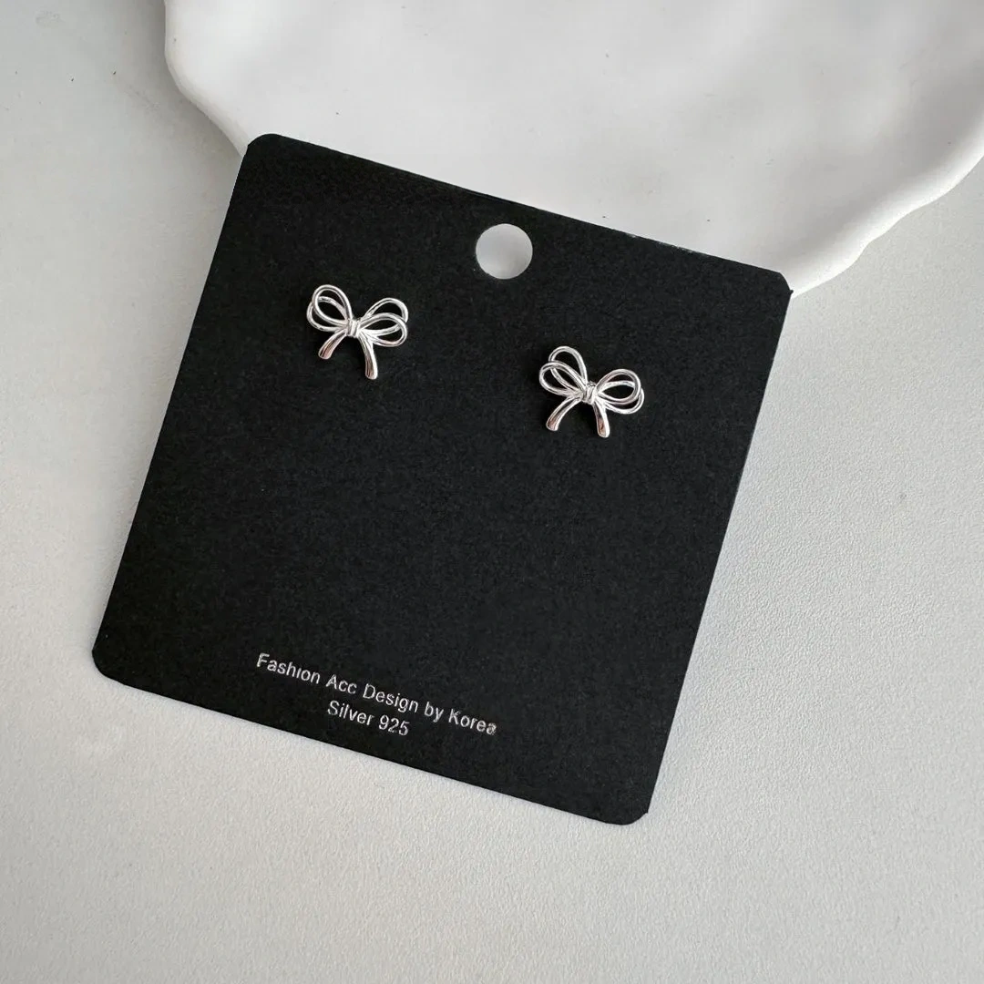 925 silver bow cut-out earrings