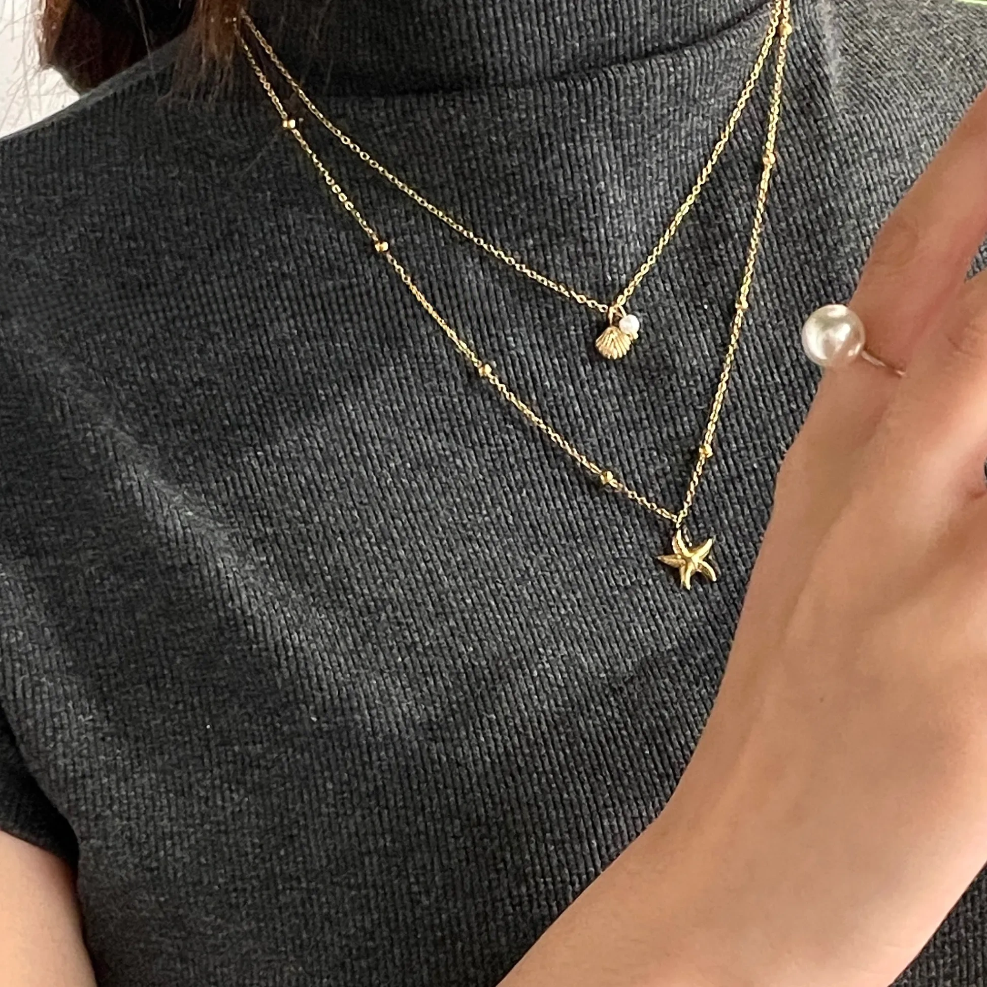 Double-layered starfish shell gold stacking necklace