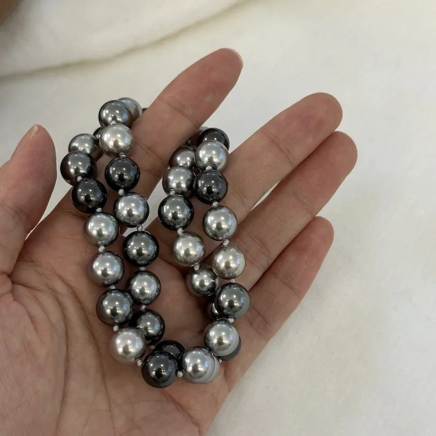 Necklace of faux melange gray-green pearls