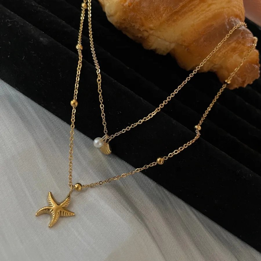 Double-layered starfish shell gold stacking necklace