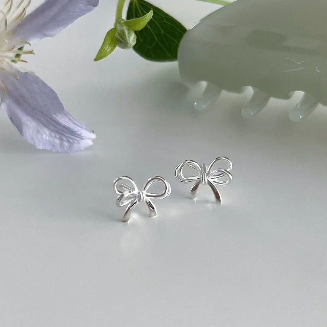 925 silver bow cut-out earrings