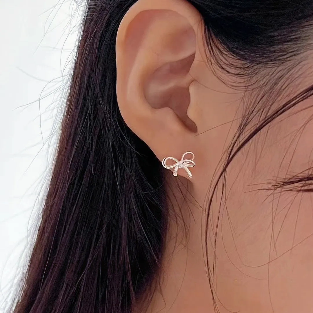 925 silver bow cut-out earrings