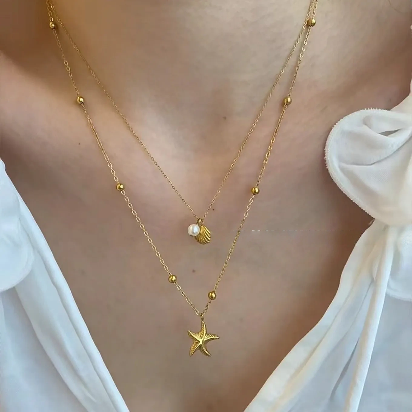 Double-layered starfish shell gold stacking necklace