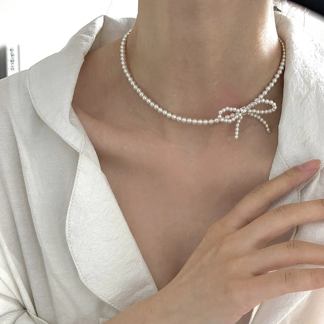 Sterling silver bow faux pearl gentle necklace