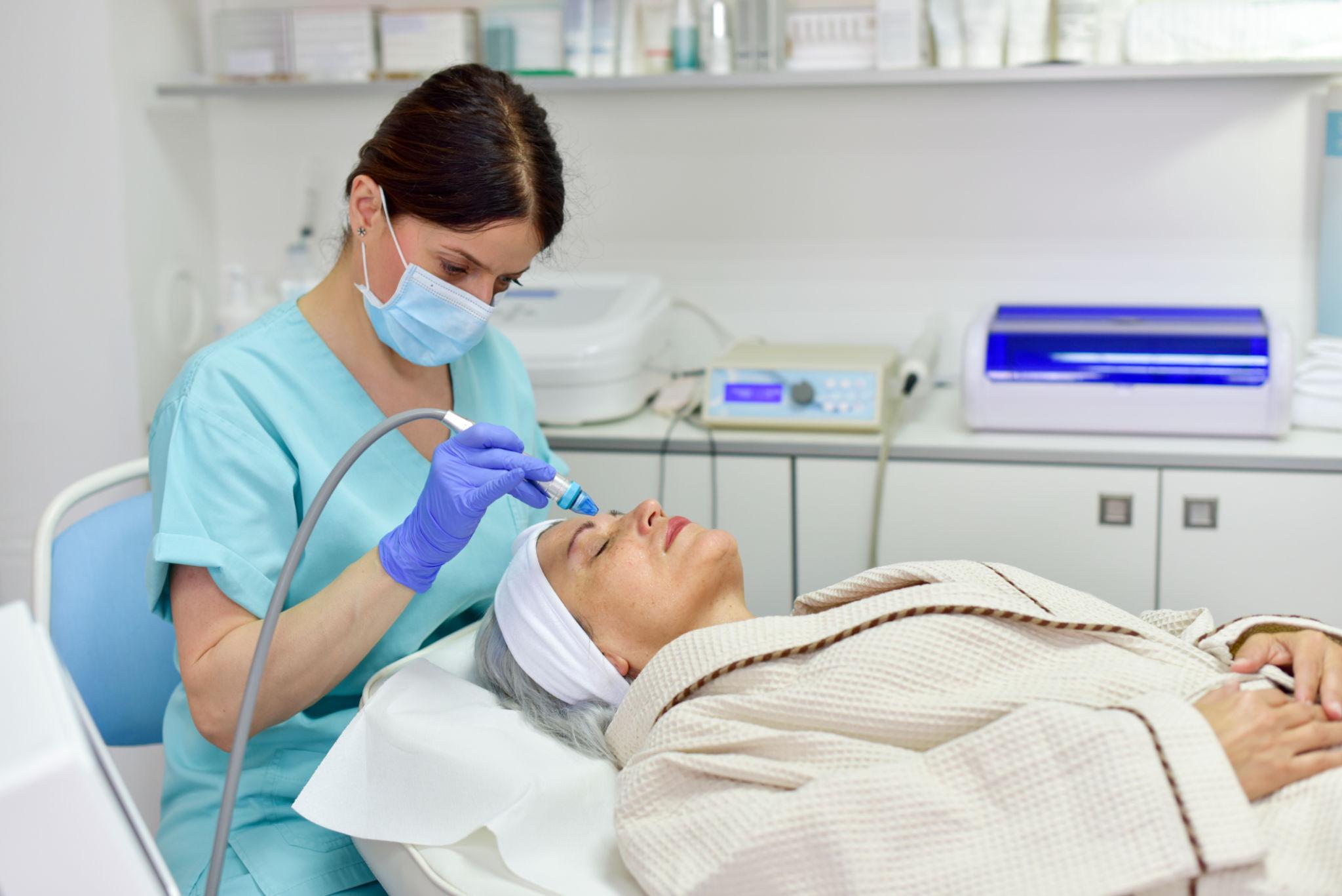 Woman receiving oxygen facial treatment