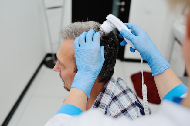 Premium Photo | Baldness. diagnostics hair and scalp