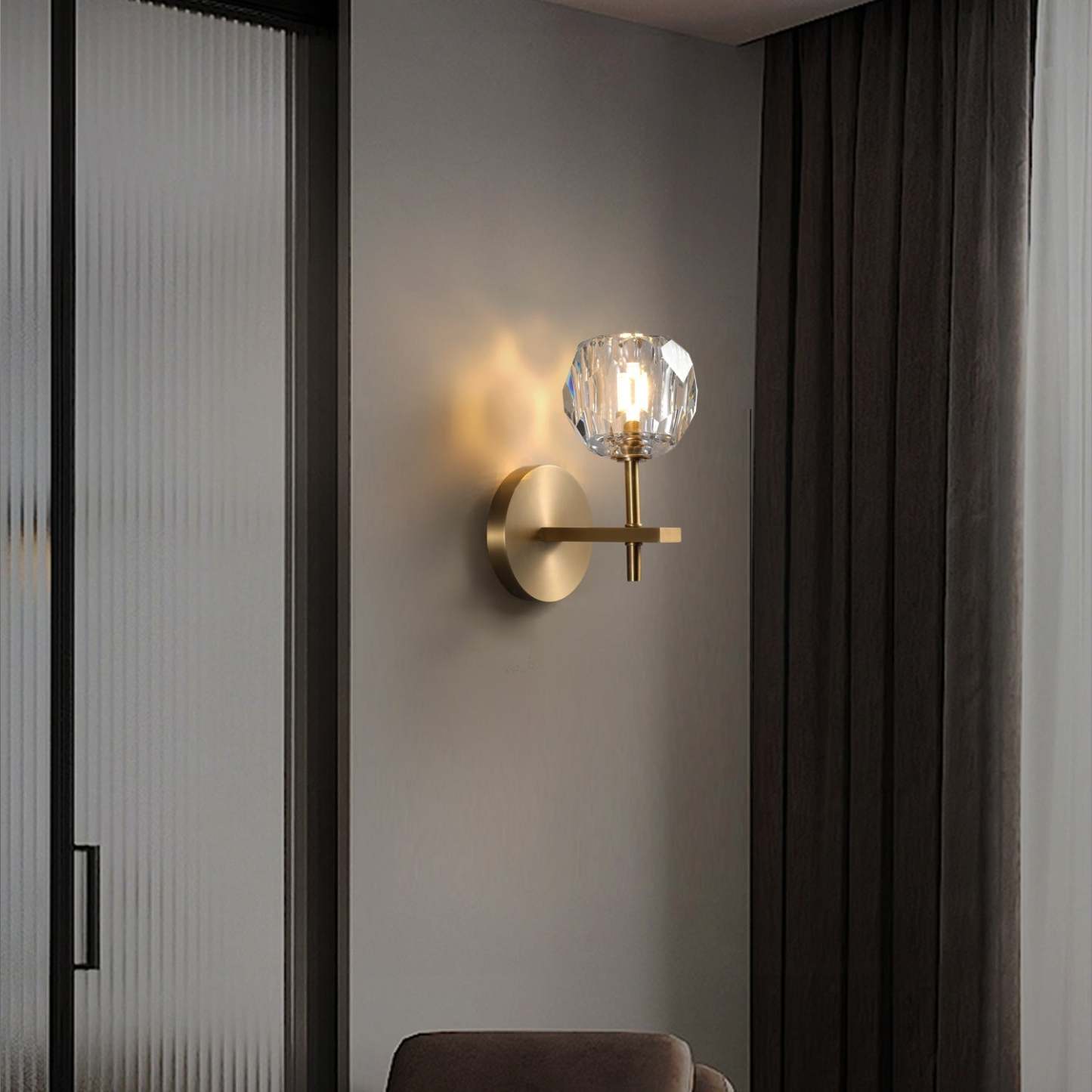 The brass and crystal glass wall lights hang in the living room, adding a touch of modern simplicity.