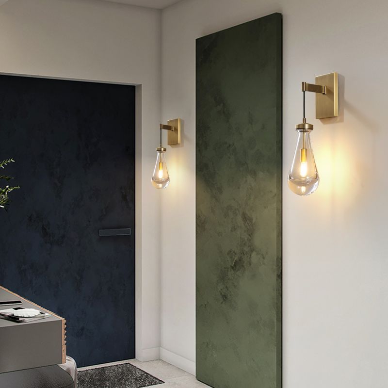 This sconce enhances the living room with its unique shape and soft illumination. It serves as a functional piece while elevating the overall ambiance.