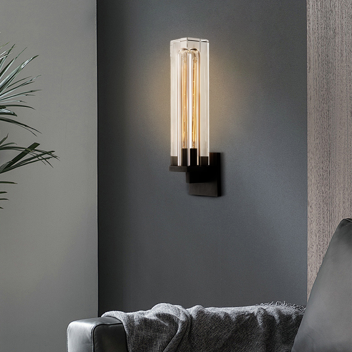 The Zylero Savill Wall Lamp, with its solid crystal block and Edison bulb, casts a refined glow in your living room, adding an ethereal touch to your space.