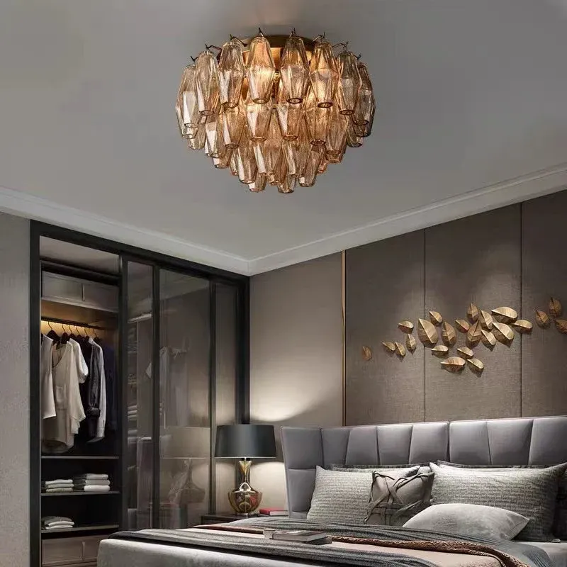 Glass flushmount chandelier with layered amber glass, creating a warm and inviting ambiance in a modern bedroom
