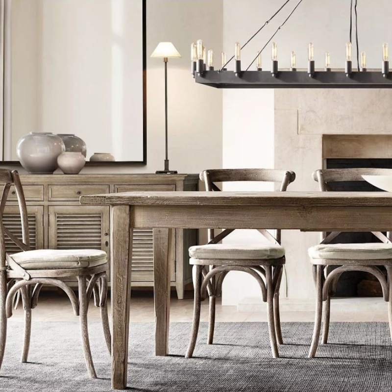 Illuminate your dining experience with Zylero's grand chandelier, a rustic and elegant centerpiece inspired by the early 20th century's industrial aesthetics, crafted to enhance any tabletop ambiance.
