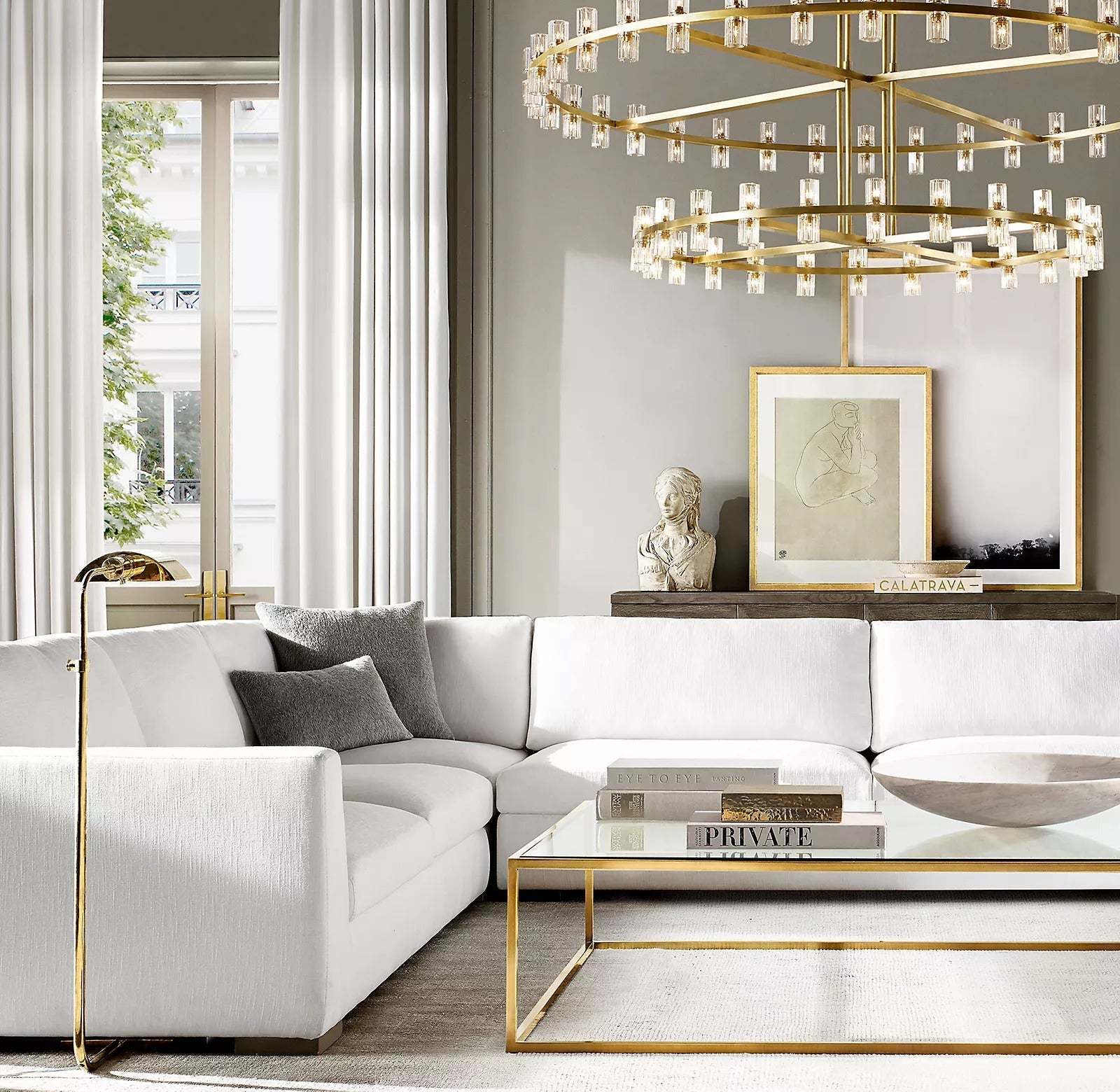 Zylero's chandelier enhances your living room with its striking design, featuring interlocking spokes and crystal glass that create a captivating focal point.