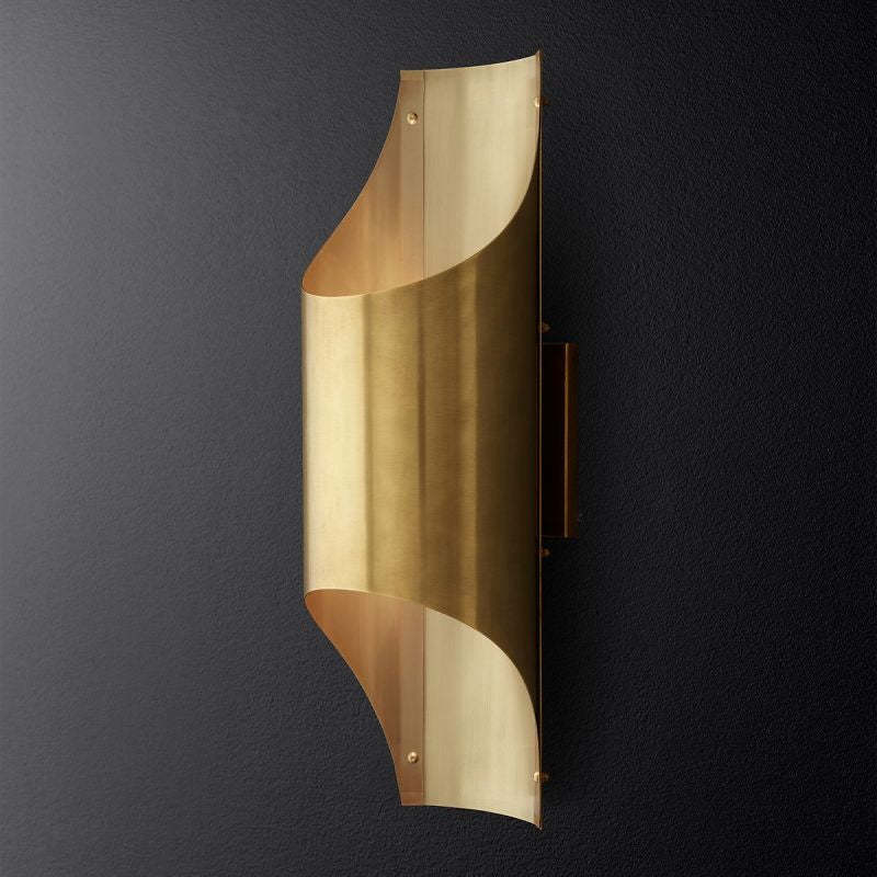 A gold solid copper LED modern wall light mounted on the wall.