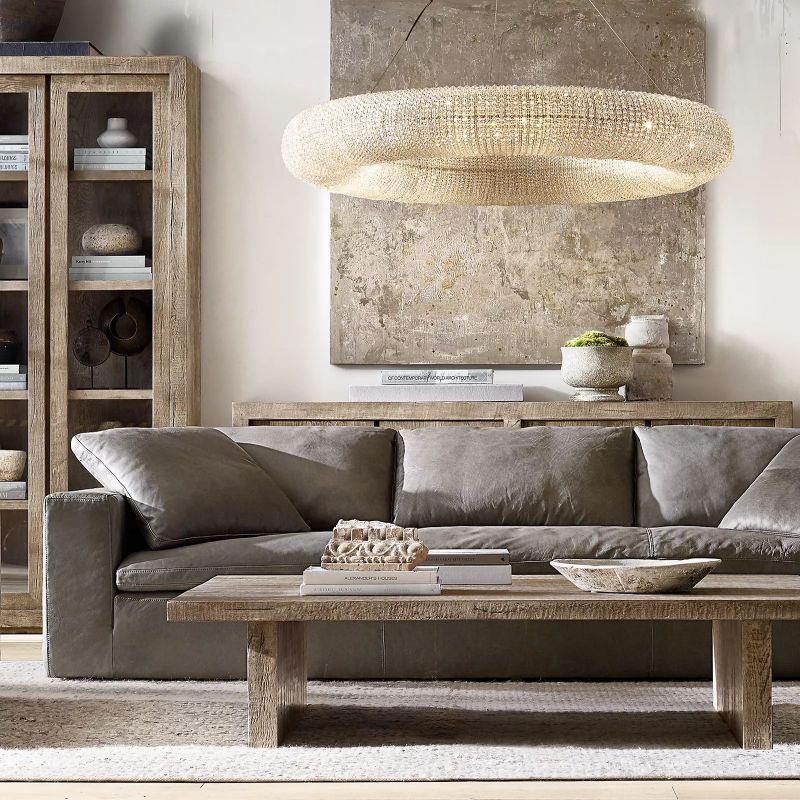 The floating sphere design of the chandelier brings a simple yet stylish touch to the living room decor.