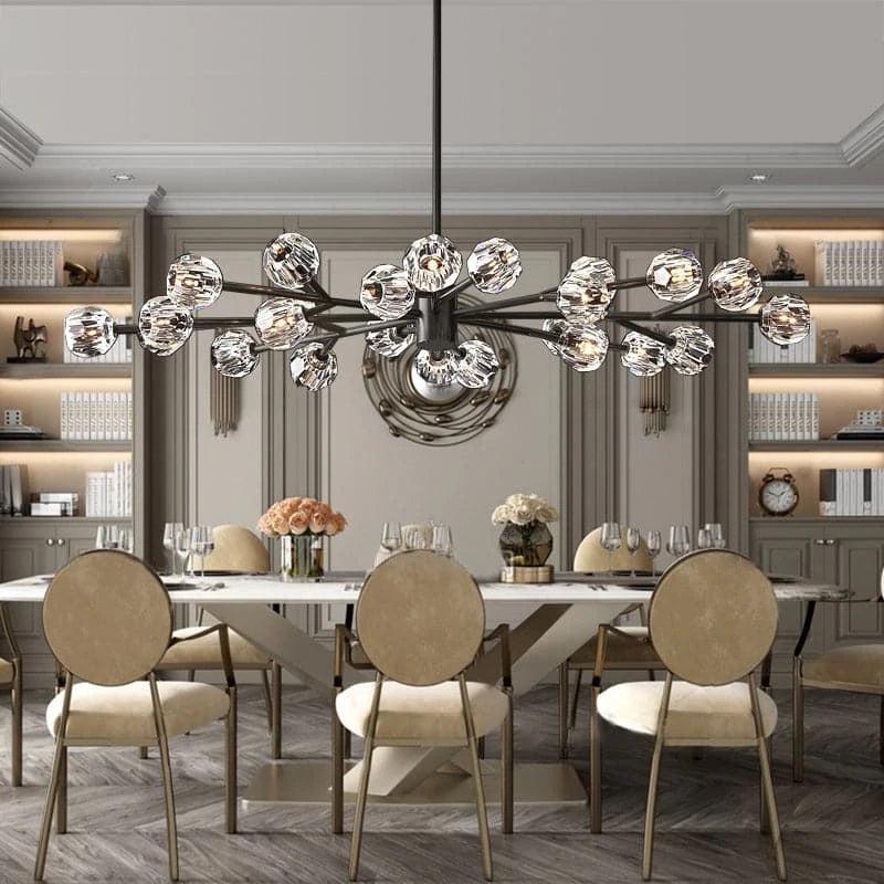 The faceted spheres of the chandelier reflect light, enhancing the room's brightness without overpowering the space.