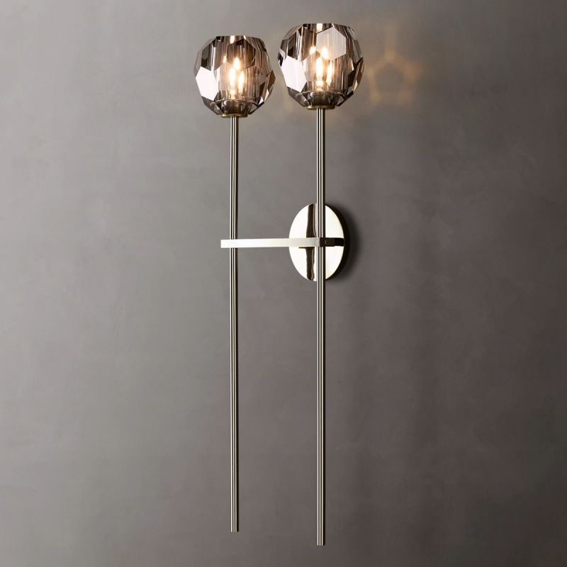 The Zylero Silver Wall Sconce adds a cool, contemporary feel to your room, with crystal glass that brightens your space with reflected light.