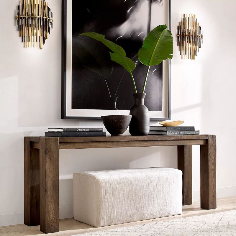 The stylish sconce filters light with metal and acrylic rods. Its shape adds interest without being too bold. It combines art and function.