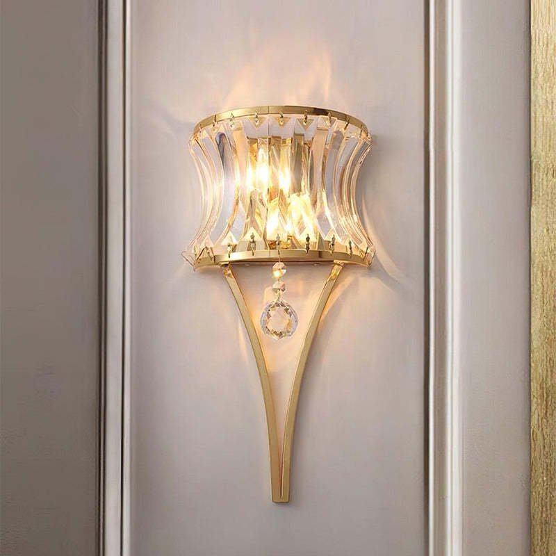 This sconce, made with arched glass panels, hangs on the living room wall and adds a soft, ambient light.