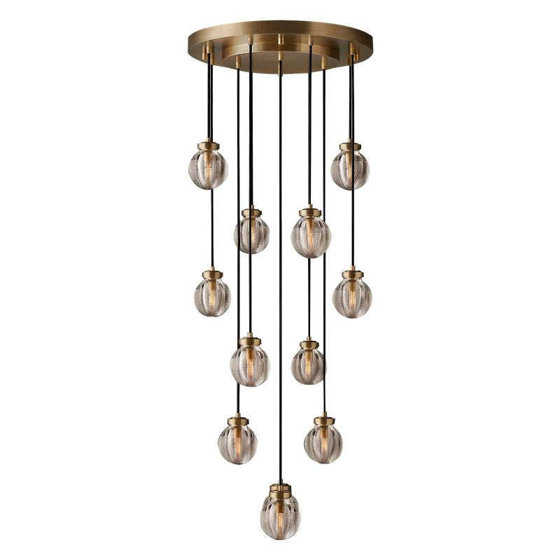Exude opulence with Zylero's Gold Chandelier, its intricately carved glass and brass elements casting a warm, inviting light in your living space.