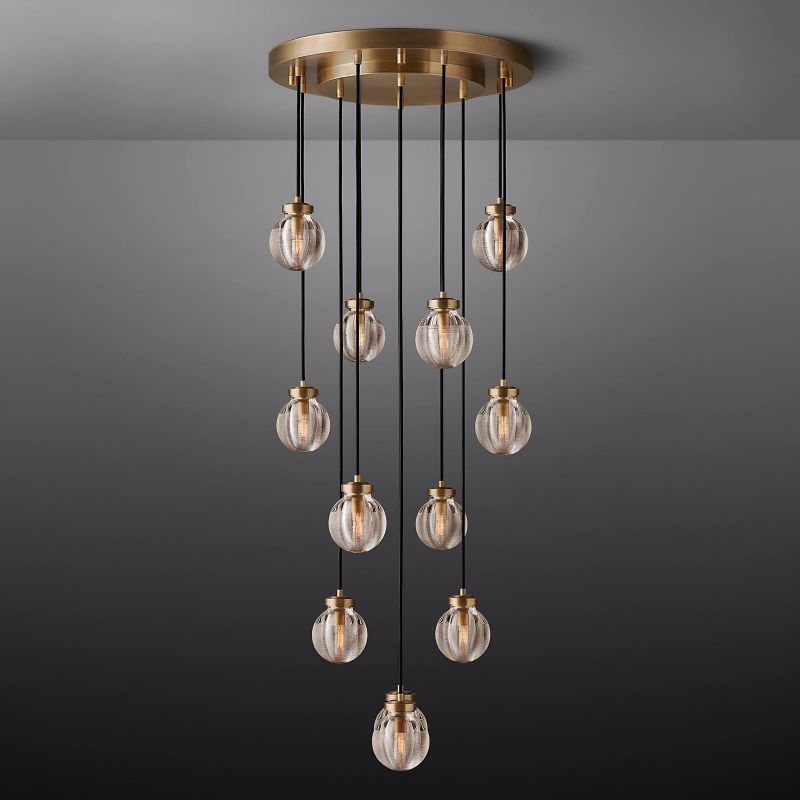 The Zylero Gold Chandelier's crystal glass balls and brass fittings create a luxurious ambiance in your living room, with a design that captures the essence of natural beauty.