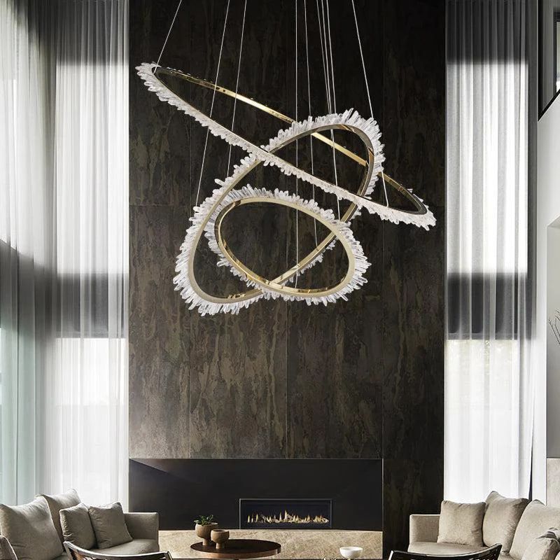 The Rock Crystal Ring Chandelier adds a touch of luxury to the living room with its modern design. Its rock crystal accents enhance the overall elegance of the space.