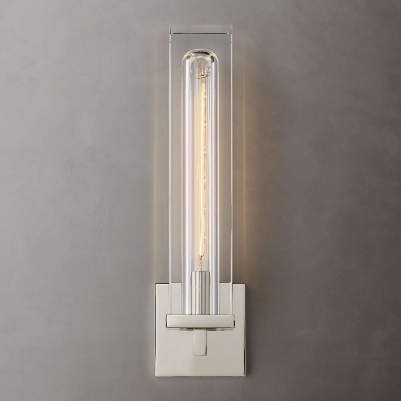 With its silver finish, Zylero's Savill Wall Lamp offers a sleek look, refracting light through its meticulously carved crystal block for a mesmerizing effect.