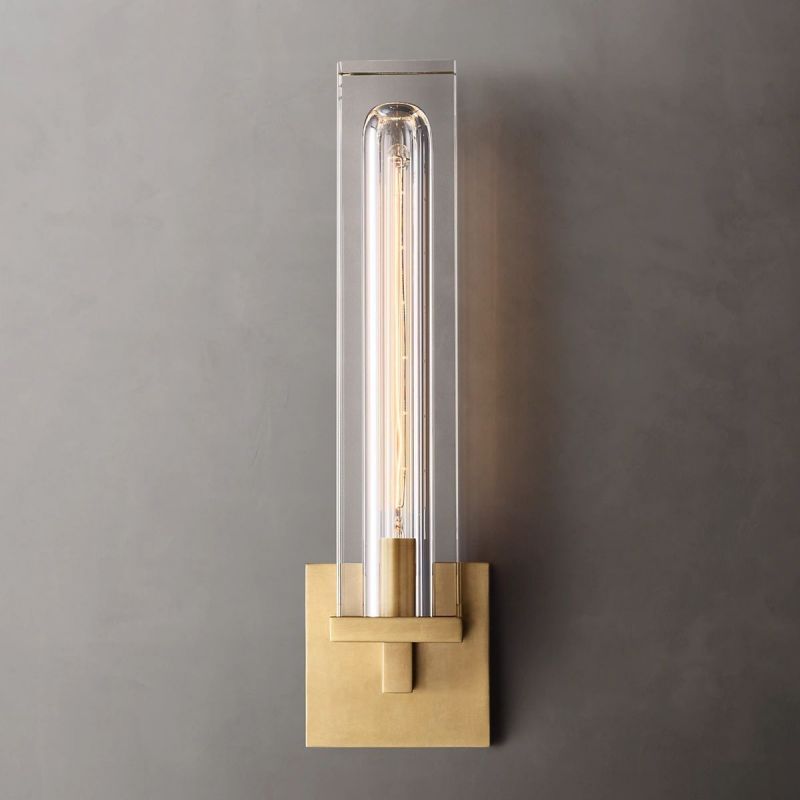 Exude elegance with Zylero's gold Savill Wall Lamp, where a monumental crystal block refracts light, creating a luxurious ambiance.