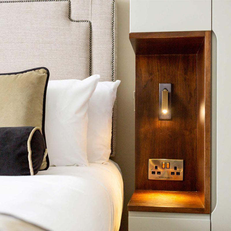 A lit on Embedded Bedside Sconce besides the bed