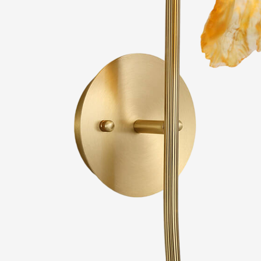 The Zylero Lotus Leaf Sconce's bracket is a testament to fine craftsmanship, providing a sturdy base that highlights the leaf's natural beauty.
