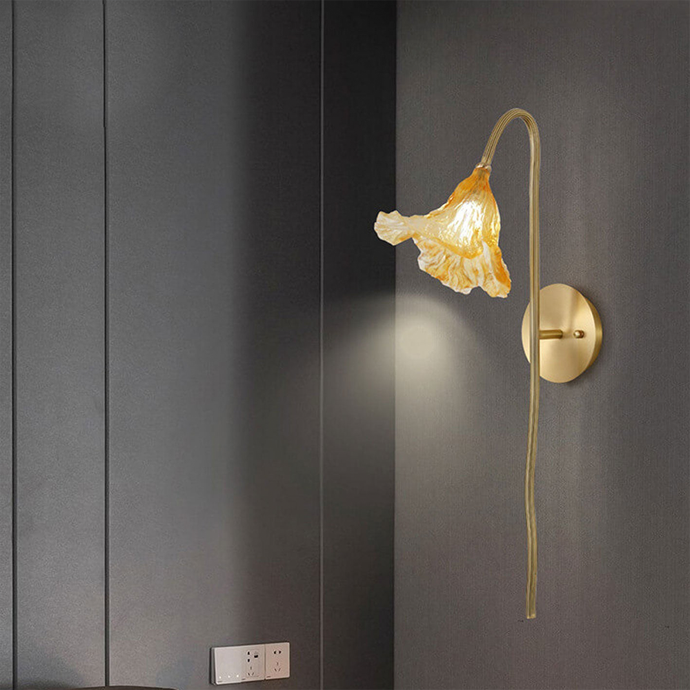 Add a touch of natural elegance to your living room with the Zylero Lotus Leaf Sconce, its delicate curves creating a warm and inviting atmosphere.