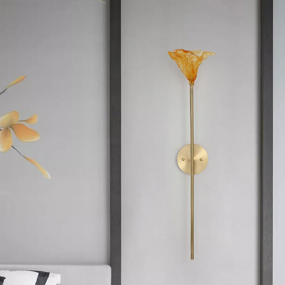 The Zylero Lotus Leaf Wall Sconce graces your living room with its nature-inspired design, casting a soft, ambient light that enhances the space's tranquility.