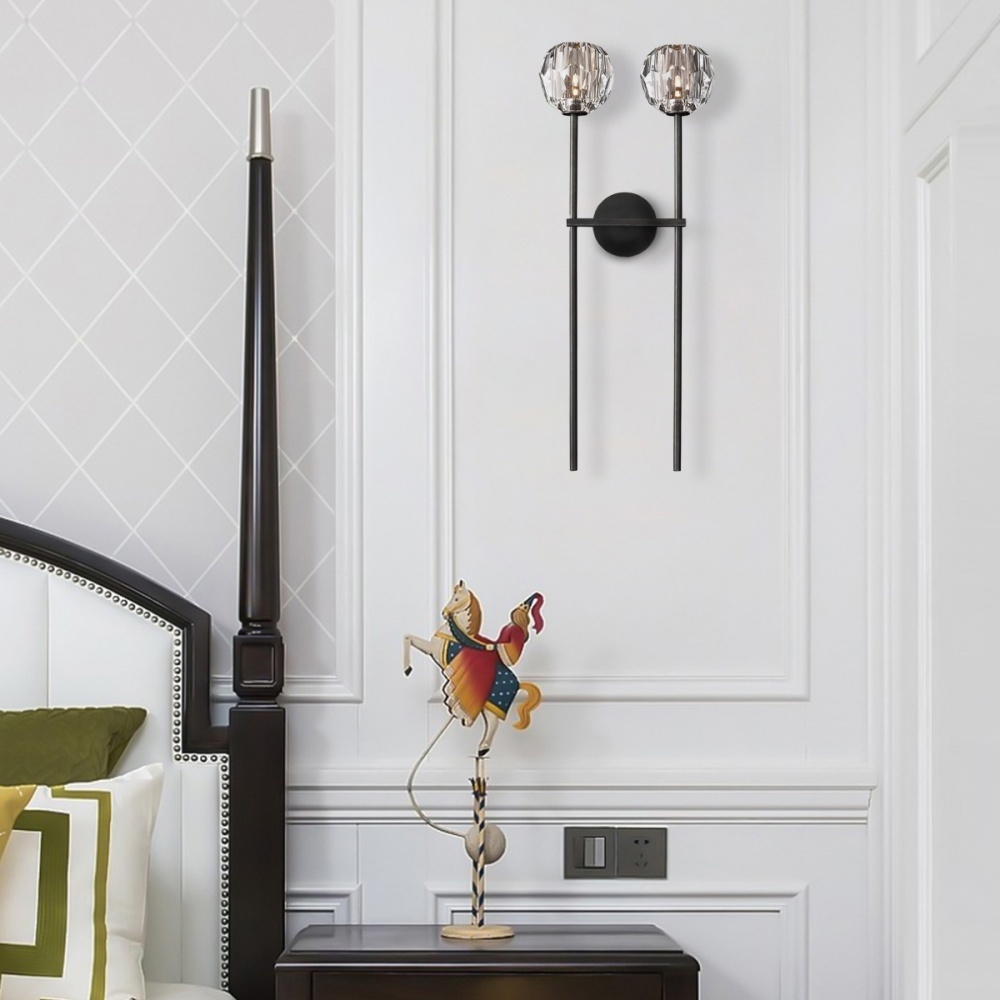 Create a serene atmosphere in your bedroom with the Zylero Wall Sconce, where crystal glass and brass work together to cast a soft, ambient light, perfect for relaxation.