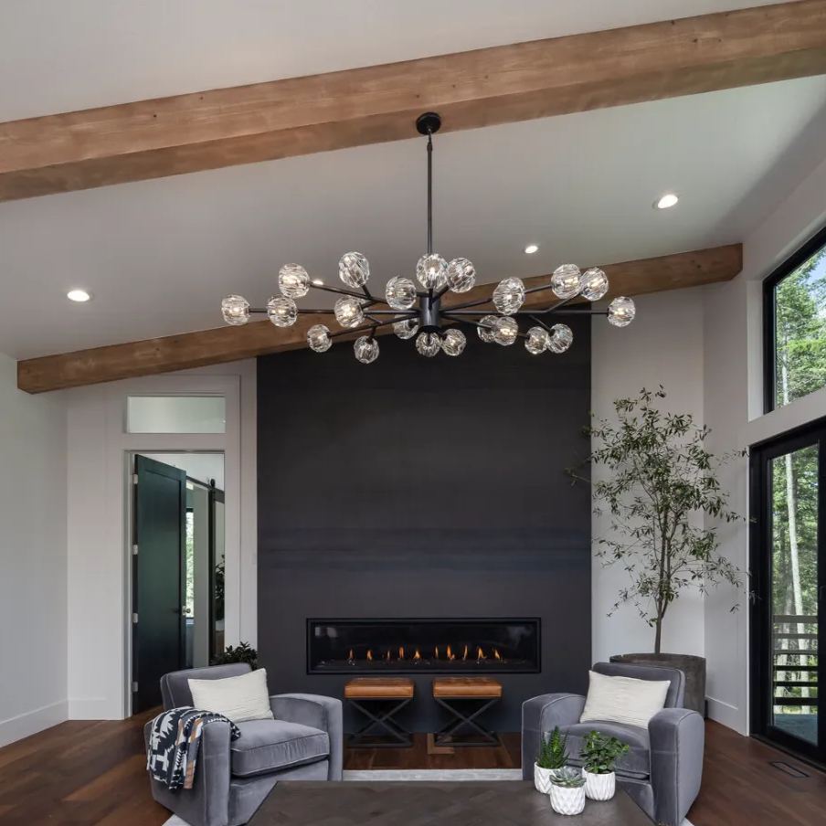 The chandelier’s hand-polished spheres gently refract light, adding a subtle shine to the living room.