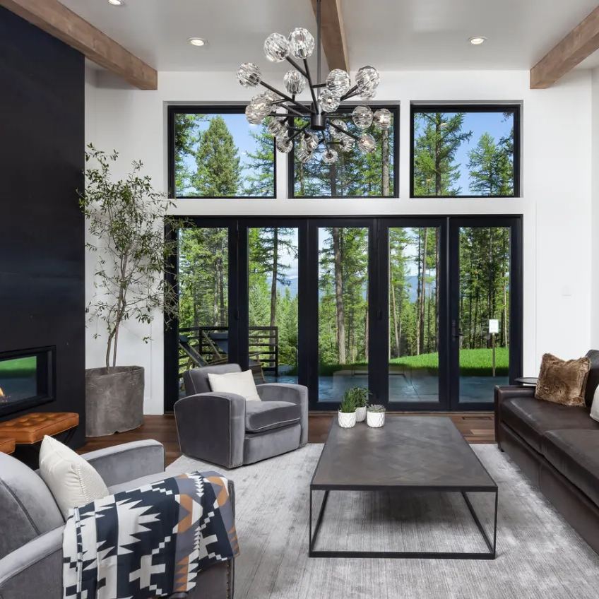 This chandelier brings a modern touch to the living room, with its crystal glass and brass design offering a clean, polished look.
