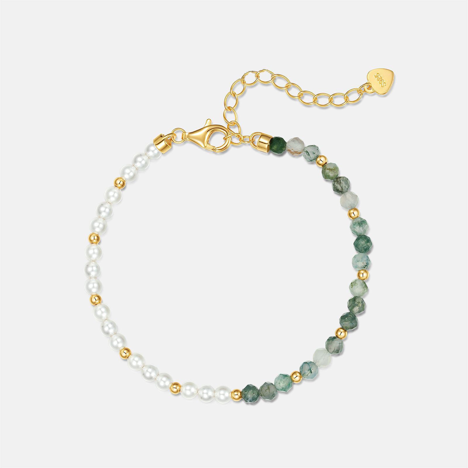 Bracelet on marble surface with elegant light reflection
