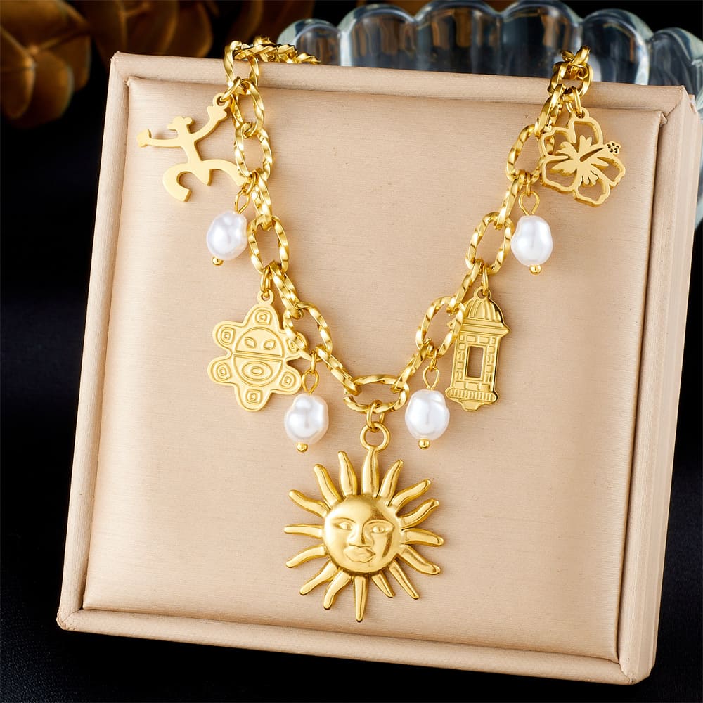 Sun Charm Necklace – Gold-Plated Multi-Pendant Chain with Floral & Pearl Accents