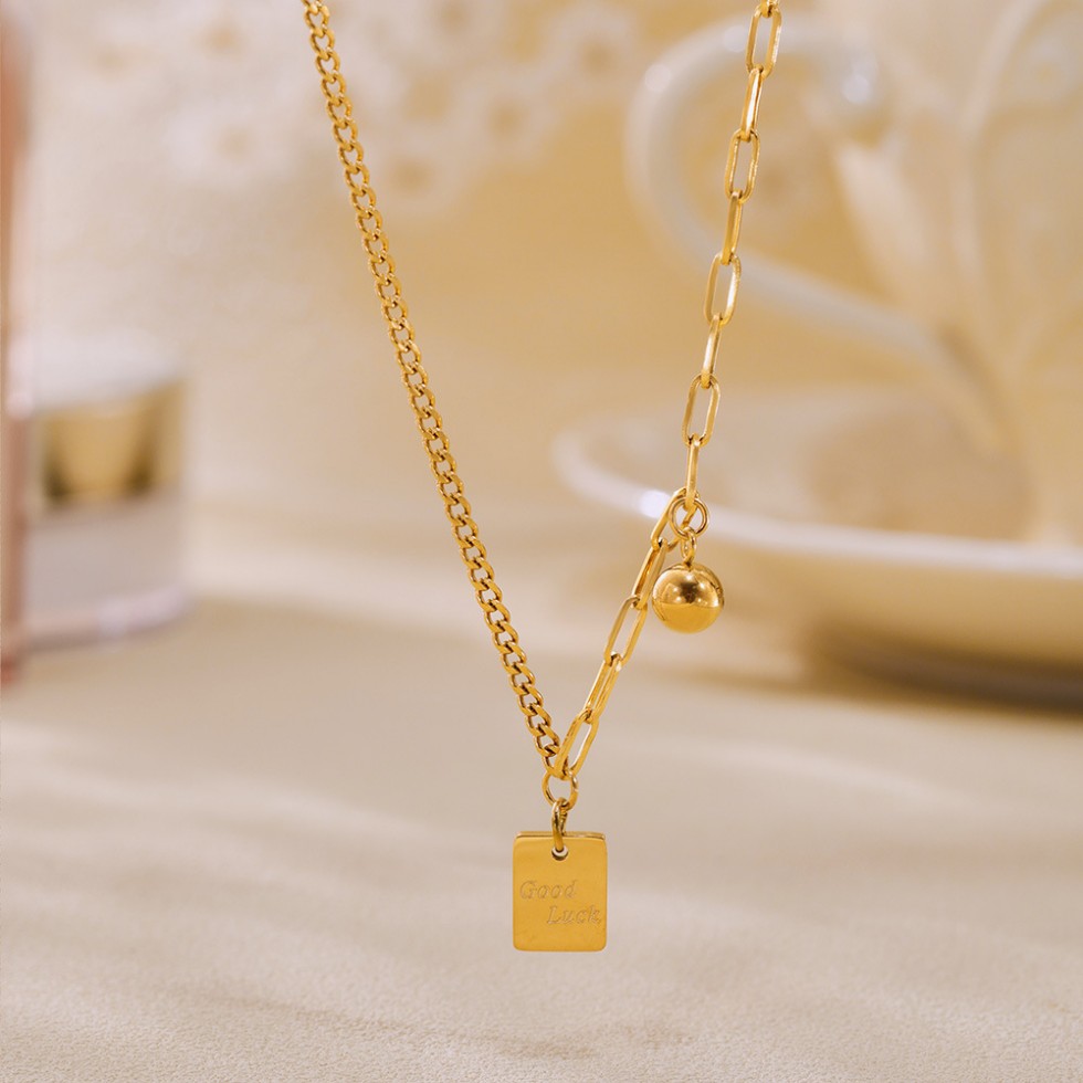 Gold Layered Necklace with “Good Luck” Square Pendant – Mixed Link Design