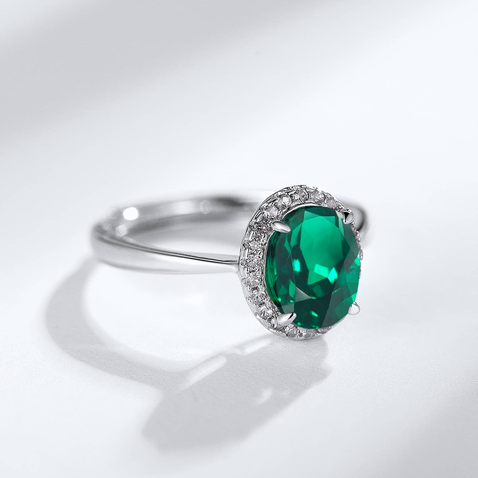 Close-up of lab-created emerald stone in May birthstone ring - Deep green prism cut clarity