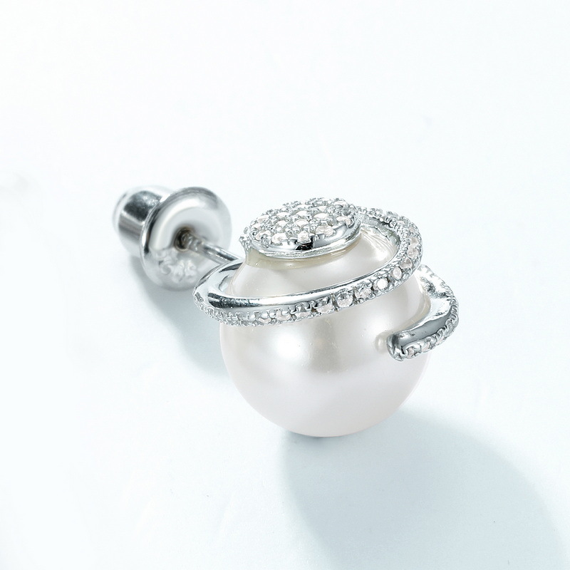 Model Wearing Minimalist Twisted Hoop Earrings with Casual Denim