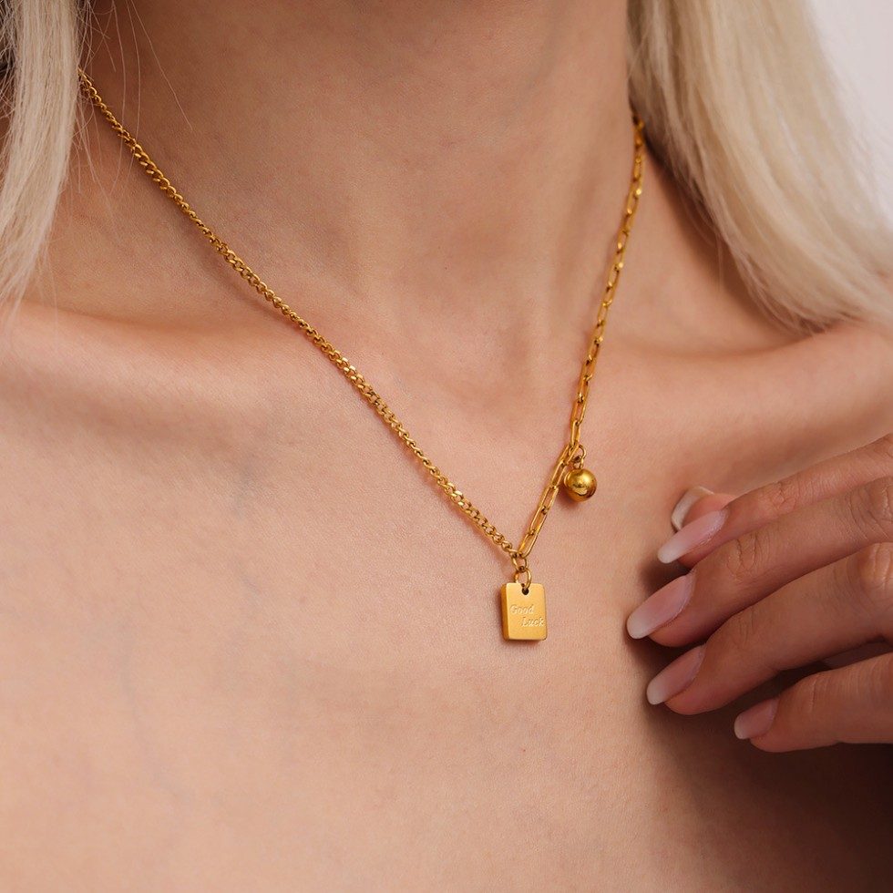 Gold Layered Necklace with “Good Luck” Square Pendant – Mixed Link Design