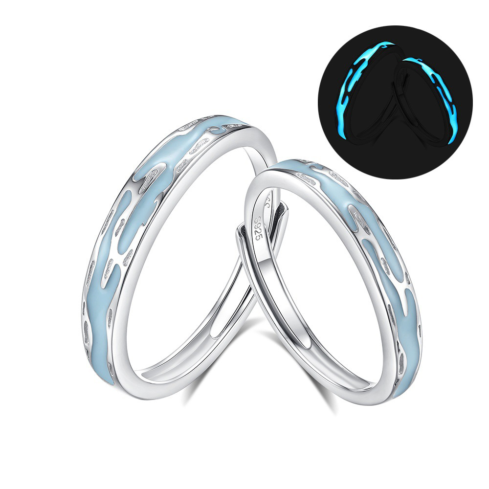 Romantic couple ring set with cultural engraving and blue-green glow