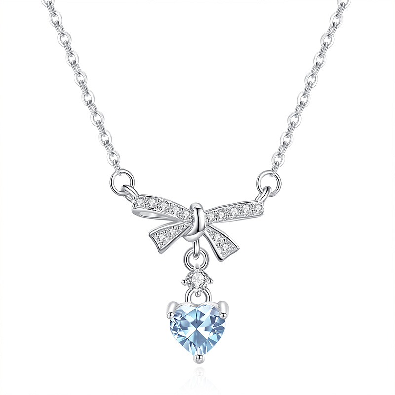 Topaz bow pendant – light blue gem paired with S925 silver bow