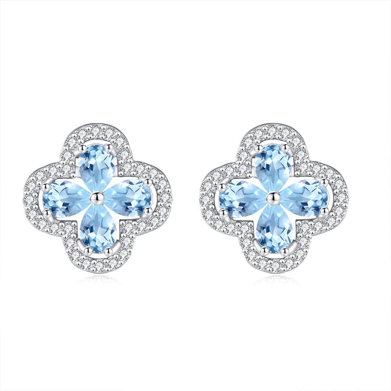 Light blue topaz flower earrings in four-leaf silver setting – December