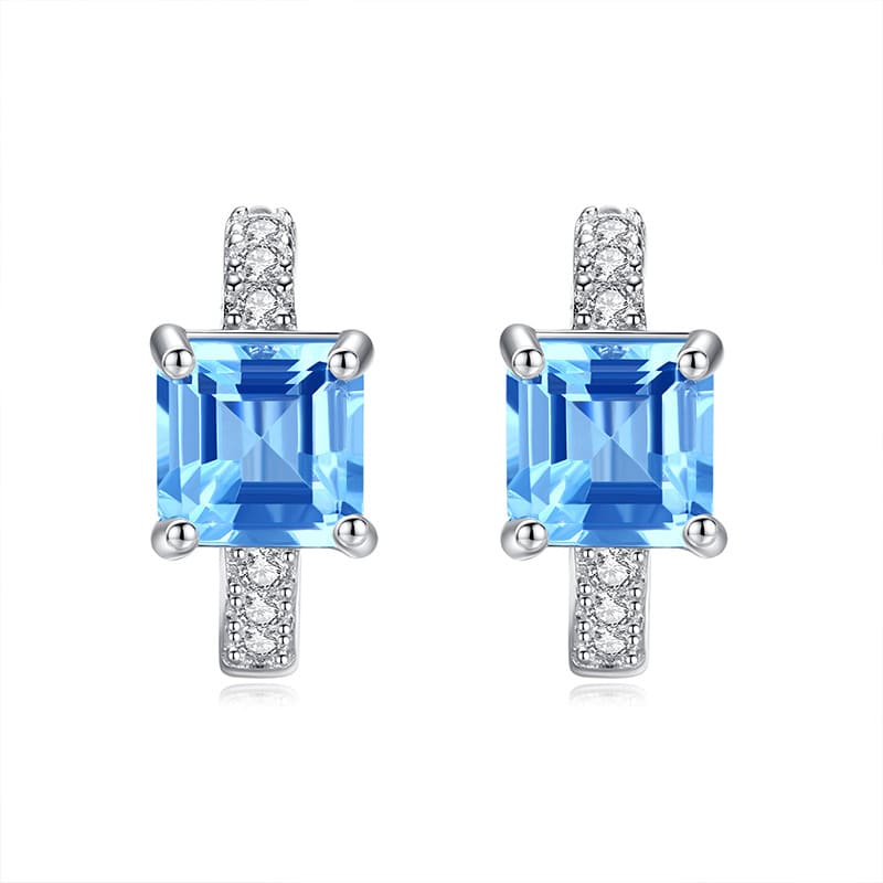 Blue topaz teardrop earrings with polished silver – December birthstone