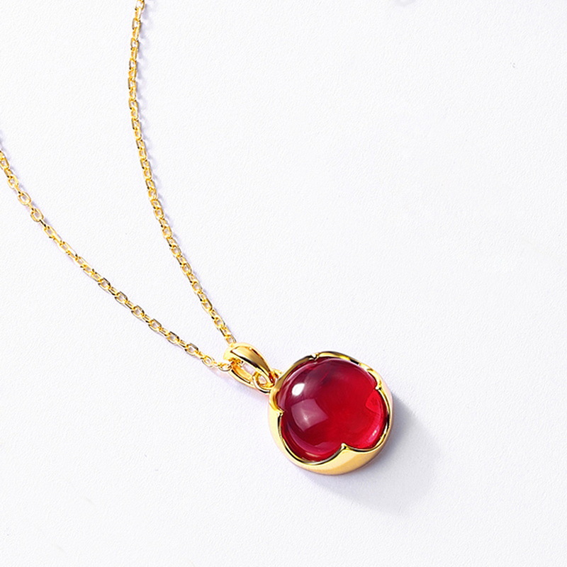 Garnet red pendant on adjustable gold chain